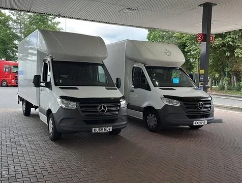 Two Compass Cargo vans refuelling before a journey