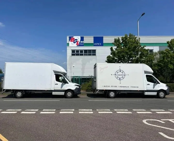 Two Compass Cargo vehicles outside a distribution centre