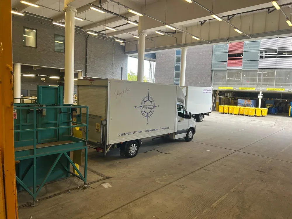 Compass Cargo truck at a large delivery site
